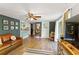 Bright living area featuring wood floors, stylish furniture, and an open layout to the kitchen at 4027 Finch Sw Rd, Powder Springs, GA 30127