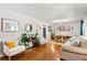 Bright living room featuring neutral paint, hardwood floors, and large windows at 4027 Finch Sw Rd, Powder Springs, GA 30127