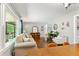 Inviting living room with stylish furnishings, hardwood floors, and a large window at 4027 Finch Sw Rd, Powder Springs, GA 30127