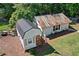 Unique outbuilding featuring a new metal roof, with a cozy porch, and manicured lawn at 4027 Finch Sw Rd, Powder Springs, GA 30127