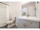 Bathroom with modern vanity, ample lighting and shower-tub combination at 5419 Golfcrest Cir, Stone Mountain, GA 30088