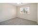 Cozy bedroom with neutral carpet, a large window, and ample natural light at 5419 Golfcrest Cir, Stone Mountain, GA 30088