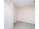 Carpeted bedroom with closet, ample natural light, and neutral paint at 5419 Golfcrest Cir, Stone Mountain, GA 30088