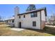 Side and back exterior view of home featuring a chimney and backyard at 5419 Golfcrest Cir, Stone Mountain, GA 30088