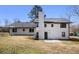 View of the rear exterior of the home with door and small patio at 5419 Golfcrest Cir, Stone Mountain, GA 30088