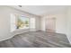 Modern living room showcasing a bay window with a view, and stylish gray-toned flooring at 5419 Golfcrest Cir, Stone Mountain, GA 30088