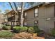 Side exterior view of home with wood trim, decks, landscaping, and visible unit number at 1003 Cumberland Se Ct # 1003, Smyrna, GA 30080