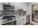 Cozy kitchen with white cabinetry, stainless steel appliances, and natural light at 1003 Cumberland Se Ct # 1003, Smyrna, GA 30080