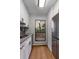 Bright kitchen featuring stainless steel fridge, sink, and white cabinets with matte hardware at 1003 Cumberland Se Ct # 1003, Smyrna, GA 30080