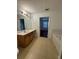 Bright bathroom features a large vanity with ample counter space and adjacent soaking tub at 1530 Viero Dr, Lawrenceville, GA 30044