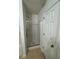 Bathroom featuring a glass-enclosed shower and white walls at 1530 Viero Dr, Lawrenceville, GA 30044