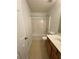 Bright bathroom features a tub and shower, a toilet, and a vanity with cabinet storage at 1530 Viero Dr, Lawrenceville, GA 30044