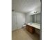Bright bathroom has a vanity with cabinet storage, tile flooring, a toilet, and a large mirror at 1530 Viero Dr, Lawrenceville, GA 30044