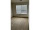 Bedroom has neutral carpet, white walls, and a window with blinds at 1530 Viero Dr, Lawrenceville, GA 30044