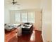 Spacious bedroom featuring wood floors, and two twin beds illuminated by natural light from multiple windows at 1530 Viero Dr, Lawrenceville, GA 30044