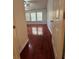 Bedroom featuring wood-look floors, bright windows, and a ceiling fan at 1530 Viero Dr, Lawrenceville, GA 30044
