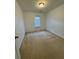 The bedroom features neutral carpet, white walls, and a door to the backyard at 1530 Viero Dr, Lawrenceville, GA 30044