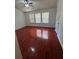 Bedroom featuring wood-look floors, bright windows, and a ceiling fan at 1530 Viero Dr, Lawrenceville, GA 30044