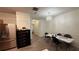 Bright dining area with modern chandelier, neutral tones, and stainless steel refrigerator at 1530 Viero Dr, Lawrenceville, GA 30044