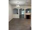 Open dining area with modern flooring, chandelier, and view to other rooms at 1530 Viero Dr, Lawrenceville, GA 30044