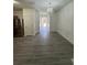 Open dining area with modern flooring, chandelier, and view to the kitchen at 1530 Viero Dr, Lawrenceville, GA 30044