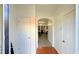 Inviting hallway with decorative archway and a mix of wood and wood-look floors at 1530 Viero Dr, Lawrenceville, GA 30044