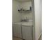 Laundry room featuring a washer and dryer with a shelf above them at 1530 Viero Dr, Lawrenceville, GA 30044