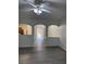 Bright living room with modern flooring, view to the kitchen and a chandelier at 1530 Viero Dr, Lawrenceville, GA 30044