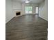 Spacious living room with modern gray flooring and cozy fireplace at 1530 Viero Dr, Lawrenceville, GA 30044
