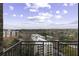 Balcony view of city skyline and trees from an apartment complex on a clear day at 2233 Peachtree Ne Rd # 902, Atlanta, GA 30309