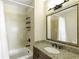 Traditional bathroom featuring a tub-shower combo and granite vanity at 2233 Peachtree Ne Rd # 902, Atlanta, GA 30309