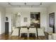 Dining area adjacent to kitchen and entryway featuring hardwood floors and neutral paint at 2233 Peachtree Ne Rd # 902, Atlanta, GA 30309