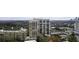 An exterior daytime view of the building with a partial view of the city skyline at 2233 Peachtree Ne Rd # 902, Atlanta, GA 30309