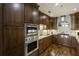 Kitchen featuring stainless steel appliances, custom cabinets and hardwood flooring at 2233 Peachtree Ne Rd # 902, Atlanta, GA 30309