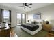 Bedroom featuring a ceiling fan, hardwood floors, and a door to the balcony at 2233 Peachtree Ne Rd # 902, Atlanta, GA 30309