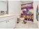 This bathroom is decorated with Minnesota Vikings football merchandise at 4559 Cabinwood Turn, Douglasville, GA 30135