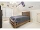 This bedroom has a wooden bedframe and is decorated in a Minnesota Vikings theme at 4559 Cabinwood Turn, Douglasville, GA 30135