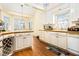 Bright kitchen with white cabinets, hardwood floors, and butcher block countertops at 4559 Cabinwood Turn, Douglasville, GA 30135