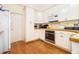 Functional kitchen featuring white cabinets, stainless steel appliances, and wooden countertops at 4559 Cabinwood Turn, Douglasville, GA 30135