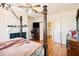 This main bedroom features a fireplace, a ceiling fan, and a four-poster bed at 4559 Cabinwood Turn, Douglasville, GA 30135