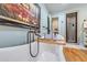 Clawfoot tub featuring stylish fixtures and a view of the modern walk-in shower at 4770 Hilltop Nw Dr, Acworth, GA 30101
