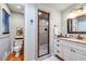 Bright bathroom with granite counters, double vanity, and a tiled walk-in shower at 4770 Hilltop Nw Dr, Acworth, GA 30101