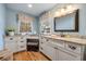 Bathroom featuring double vanity, granite countertop, makeup table, and stylish mirror at 4770 Hilltop Nw Dr, Acworth, GA 30101