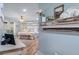 Cozy bedroom featuring wood floors and neutral decor with a decorative fireplace mantel at 4770 Hilltop Nw Dr, Acworth, GA 30101