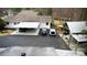 Long paved driveway with covered parking areas and multiple vehicles at 4770 Hilltop Nw Dr, Acworth, GA 30101