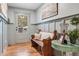 Entryway with wooden bench, coat hooks, hardwood floors, and view of the outdoor scenery at 4770 Hilltop Nw Dr, Acworth, GA 30101