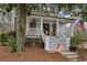 Charming craftsman style house with front porch, flag, and well-manicured yard at 4770 Hilltop Nw Dr, Acworth, GA 30101