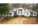 Charming white and gray two-story home with manicured landscaping at 4770 Hilltop Nw Dr, Acworth, GA 30101