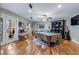Spacious game room features a pool table, hardwood floors, and custom shelving perfect for entertaining at 4770 Hilltop Nw Dr, Acworth, GA 30101