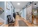 Inviting hallway features hardwood floors, natural light, and a stylish sliding barn door at 4770 Hilltop Nw Dr, Acworth, GA 30101